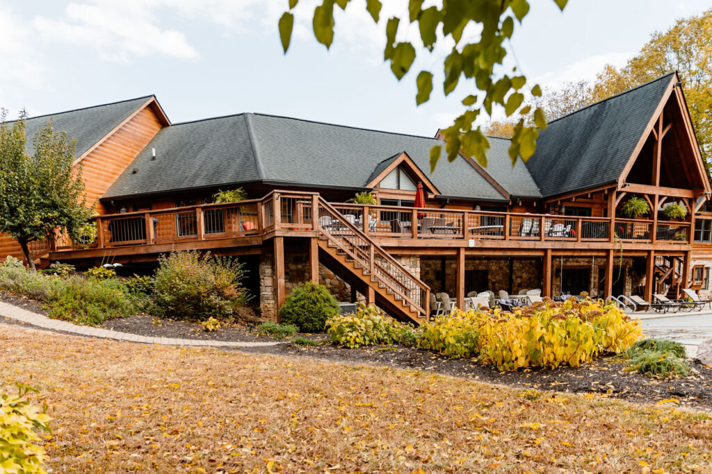 Exterior of a spacious lodge surrounded by autumn foliage at a wedding locations in Indianapolis