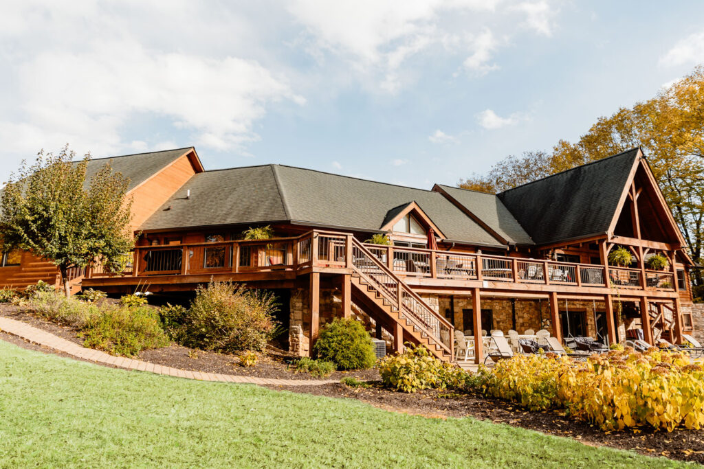 Lodge exterior with a spacious patio and beautiful landscaping