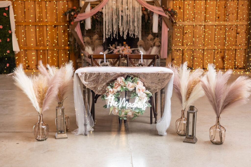 Elegant sweetheart table setup with pink and gold accents