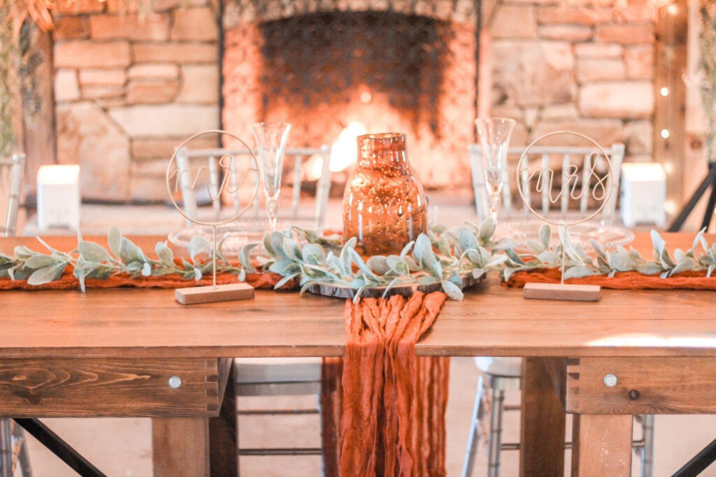 Rustic table setup with floral centerpiece and antler decor