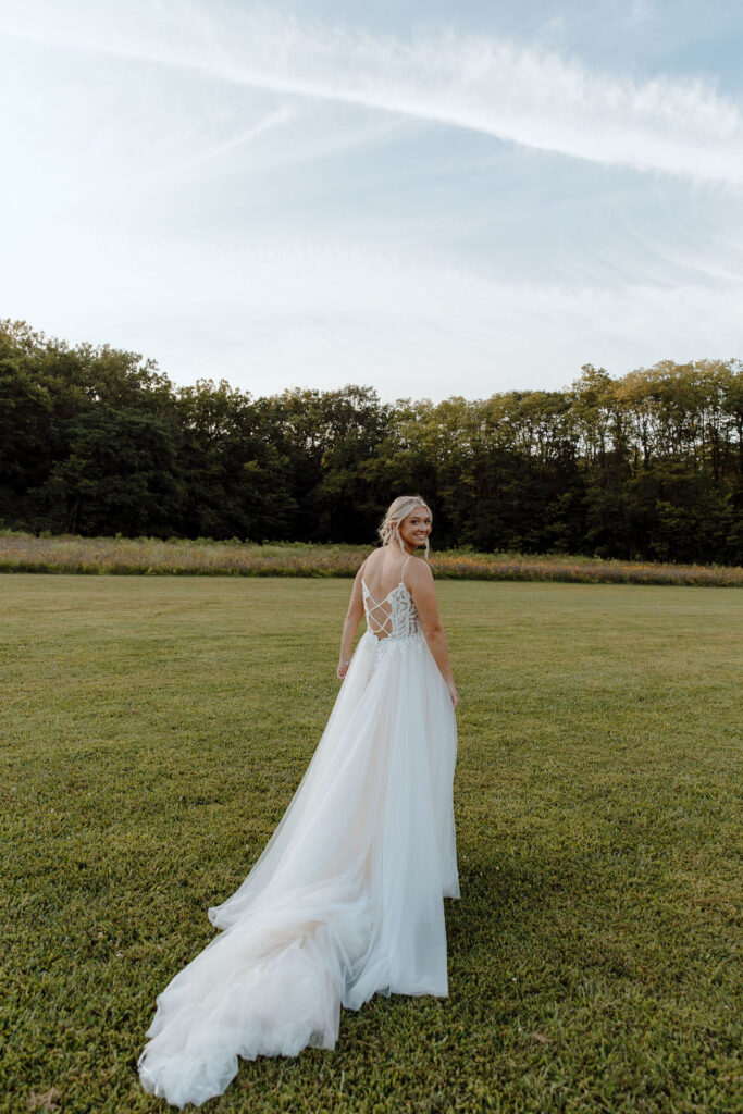 Wildflower wedding portrait of bride in lace gown
