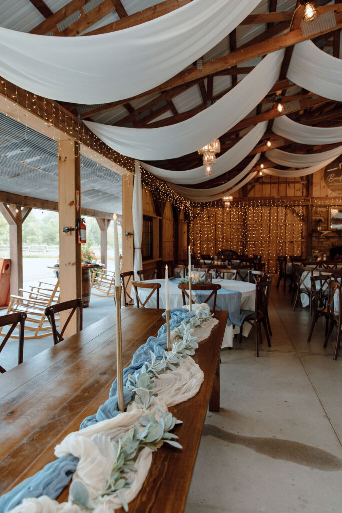 Wedding ceremony setup with long table designed with white and blue table cloth