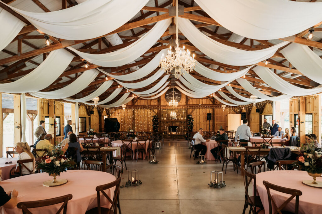 Wedding reception with dining tables and chandeliers 