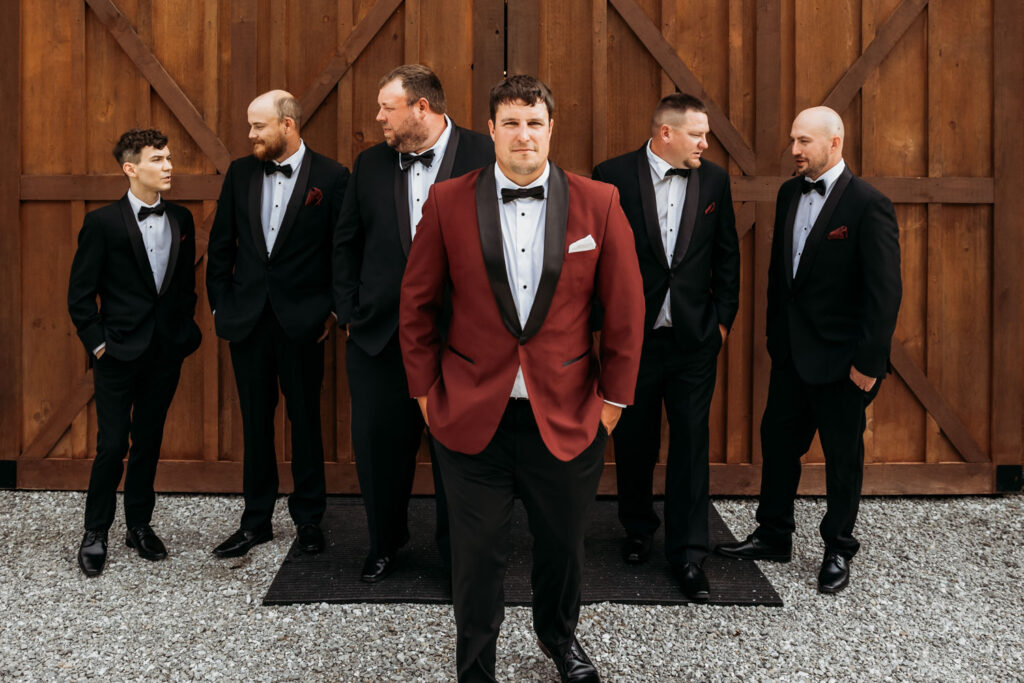 Groom with groomsmen in tuxedos at a budget wedding venue