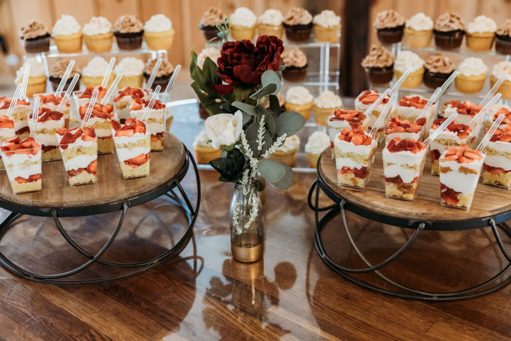 Wedding dessert table with cupcakes and parfaits at a budget wedding venue
