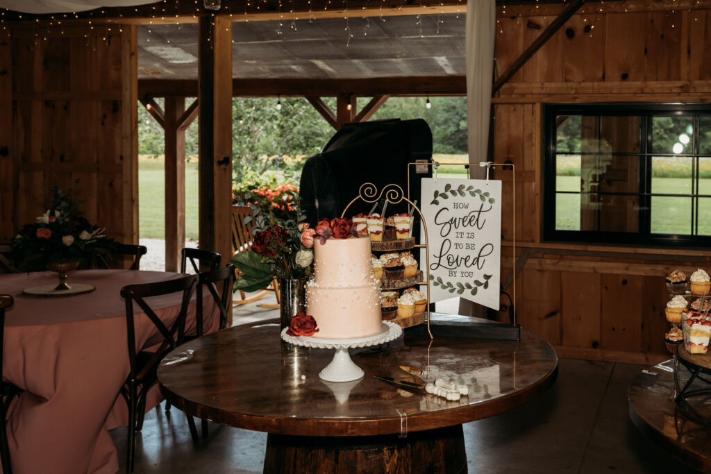 Pink wedding cake and dessert display at a budget wedding venue in Indiana