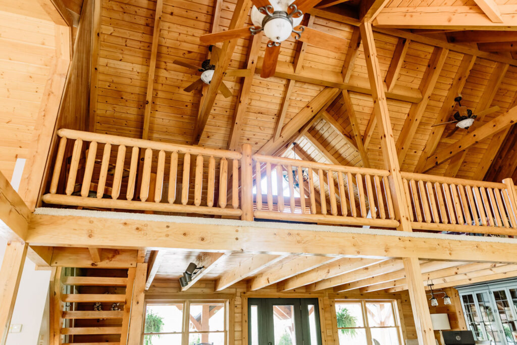 Open loft interior with exposed wood beams at Montgomery Creek Ranch lodge
