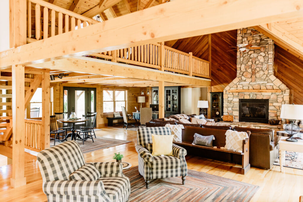 Great room interior with stone fireplace at Montgomery Creek Ranch lodge