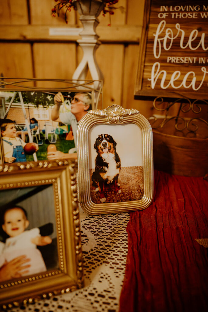 Framed memorial photos displayed at wedding reception