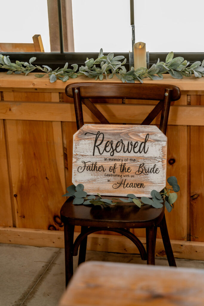 Reserved chair sign honoring the father of the bride