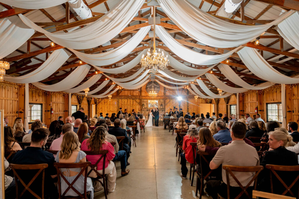 Indoor barn wedding ceremony