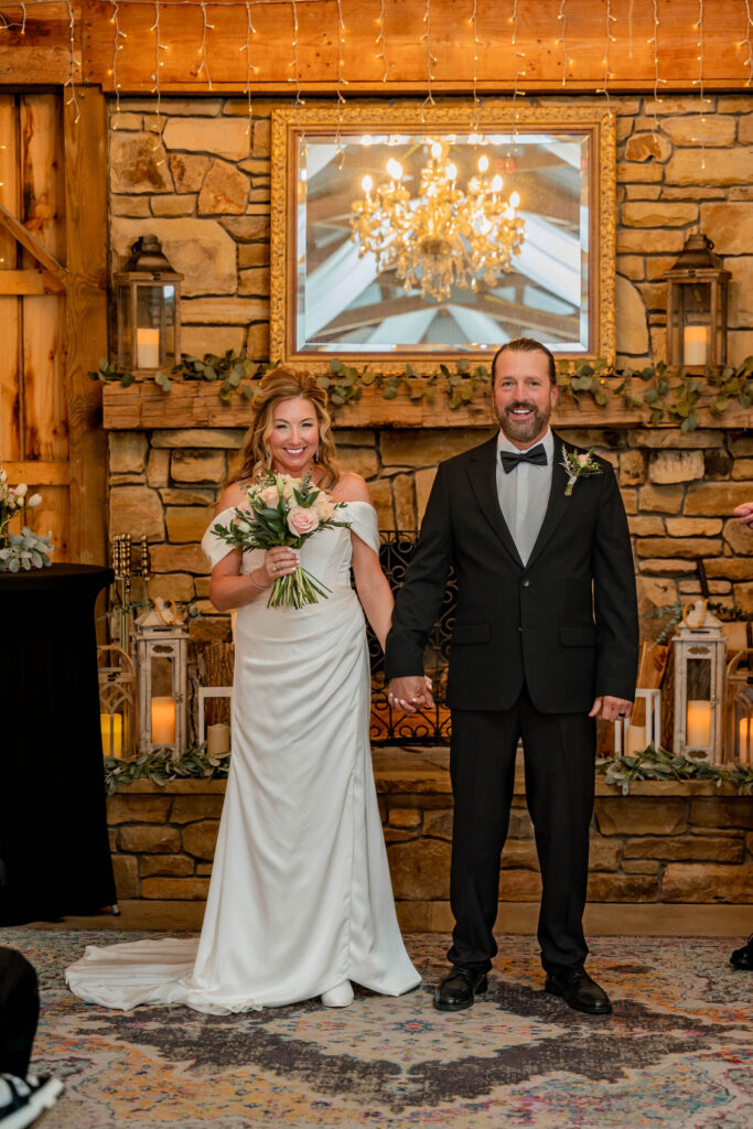 Couple by stone fireplace