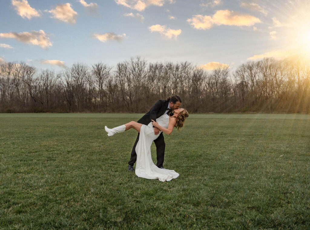 Couple dipping in a field
